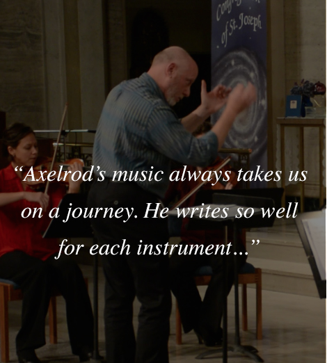 Lawrence Axelrod conducting a chamber orchestral ensemble performing one of his original compositions.